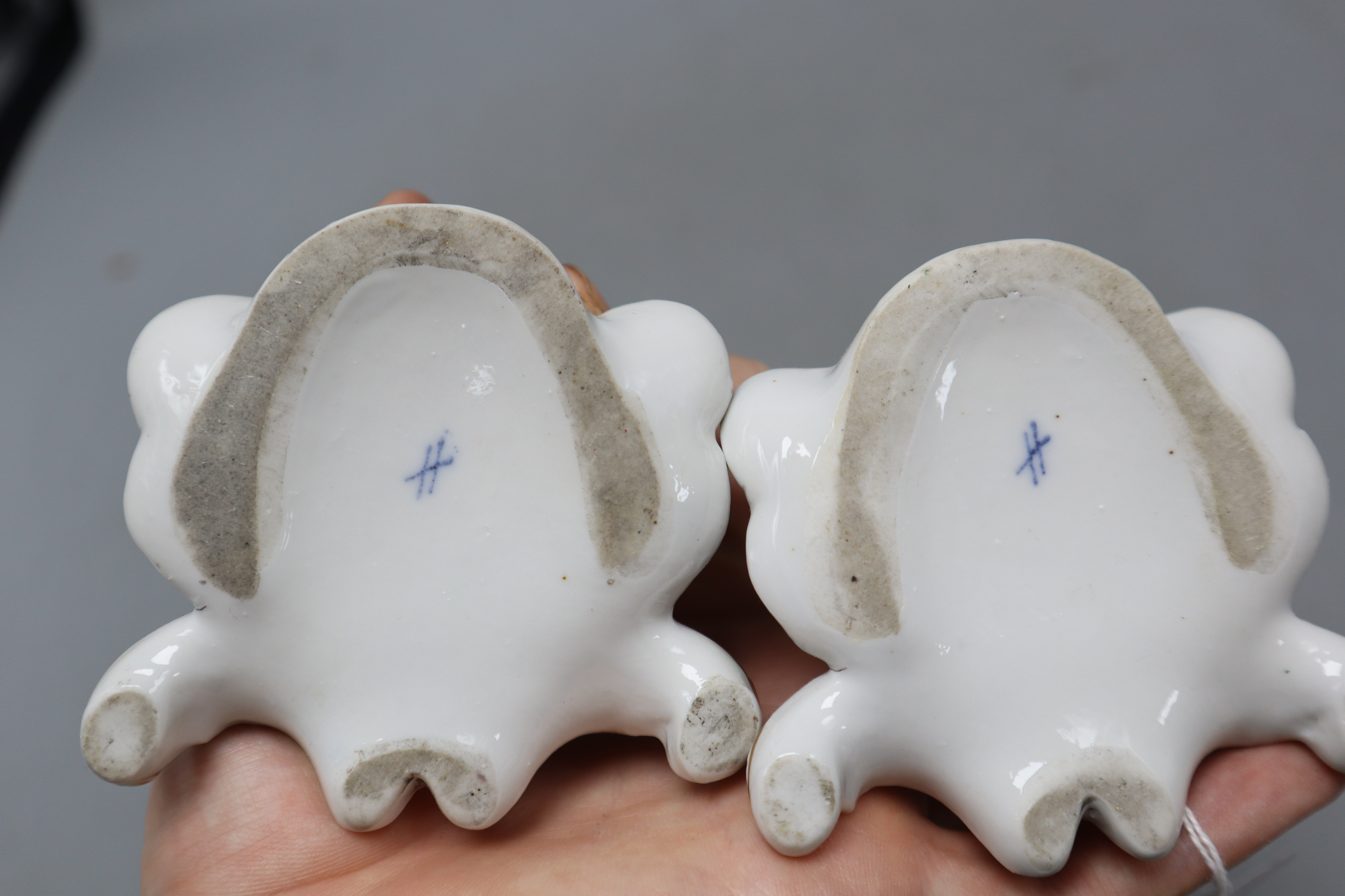 A pair of Meissen style figures of a young girl and boy, height 16cm